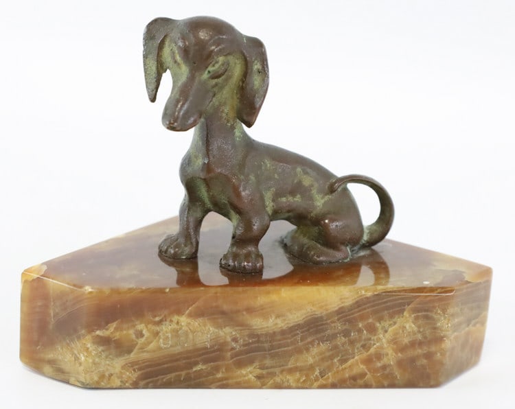 Germany 1945 Bronze Dachshund Paperweight: WWII Germany 1945 bronze sitting Dachshund marble base paperweight. Nice condition, engraved on the marble. Measures approximately 2-3/4" tall x 3-7/8" across x 2-1/2" deep. Great condition.