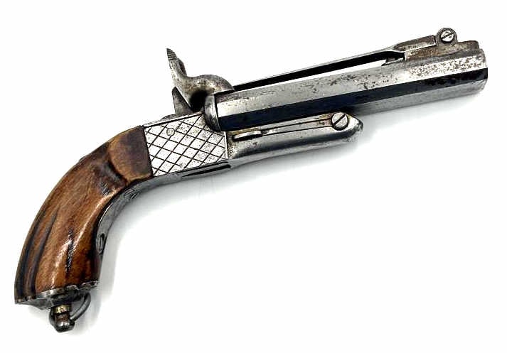Unmarked Double Barrel Percussion Pistol Bayonet: Unmarked Double Barrel Percussion Pistol Bayonet. Pistol is in nice used condition with 4.5 inch octagonal barrels. Hinged to the barrels is a 4 inch bayonet. Hammers work properly. Wood grips are in 
