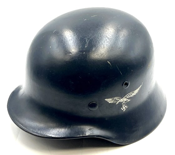 WW II German Luftwaffe M 40 Helmet: WW II German Luftwaffe M 40 Helmet. The WW II German Luftwaffe Helmet is in very nice used condition. The Helmet does not contain the liner or chin strap. Helmet is marked EF 64 and has a lot number o