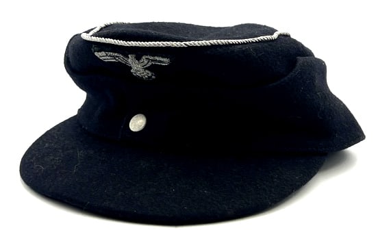 WW II German M 43 Wool Cap by Erich Beinhorn: WW II German M 43 Wool Cap by Erich Beinhorn. This WW II German M 43 Wool Cap is in very nice used condition. Inside of the wool cap reads B / B Erich Beinhorn Braunschweis. Inside of cap shows wear m