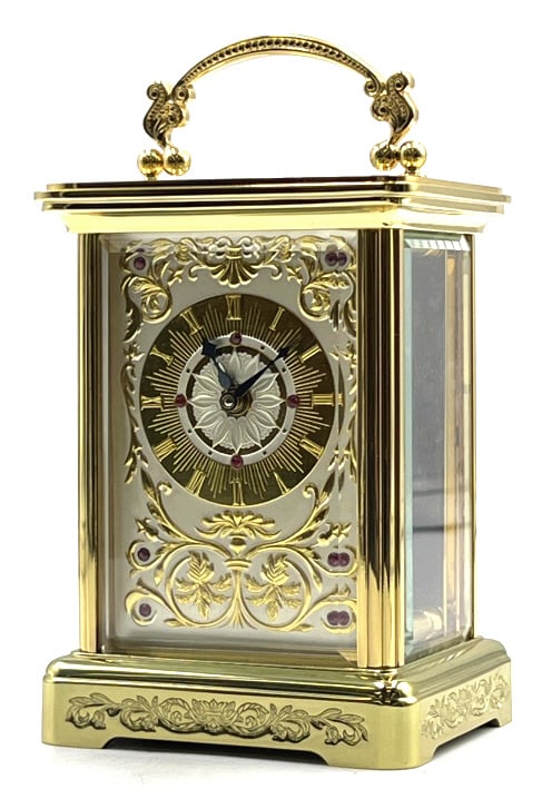 The Imperial Carriage Clock by Igor Carl Faberge: The Imperial Carriage Clock by Igor Carl Faberge for the Franklin Mint, with a solid brass body, sterling silver and 24 karat gold embellishments, set with 10 rubies. Comes with Key and original broch