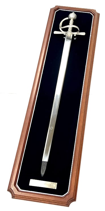 Franklin Mint The Sir Francis Drake Sword: Frankln Mint The Sir Francis Drake Sword. This Sword Comes With the Original Fitted Oak Wall Mount. The Large Double-Edged, Hand Burnished Tempered Stainless Steel Blade is Etched with Foliage, Stands