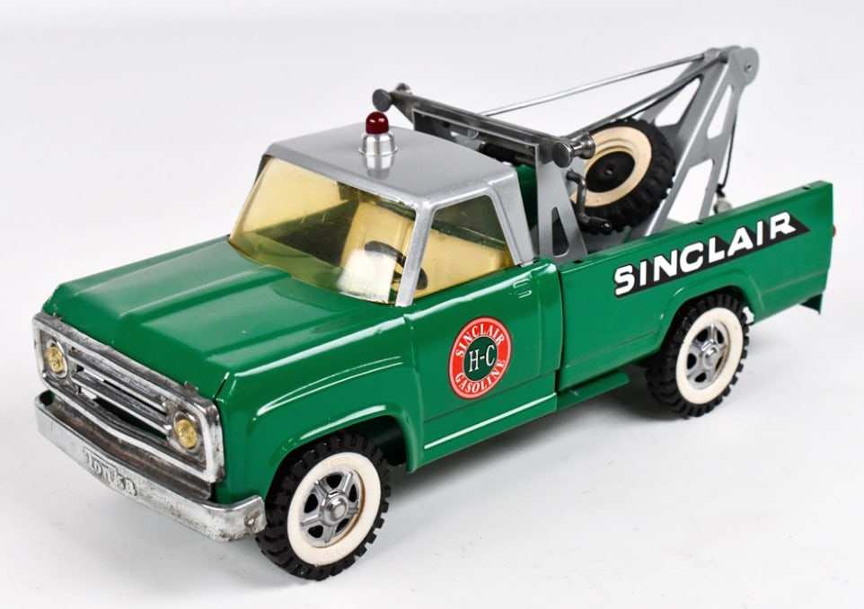 Custom Tonka Sinclair Wrecker Tow Truck: Custom Tonka Sinclair Dodge wrecker tow truck. Displays well with Sinclair decals, custom paint scheme, and siren. Good condition with some oxidation to the grill and light wear from display. Measures
