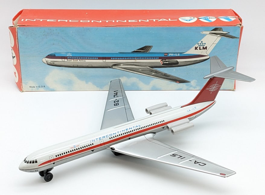 German Tin Friction Intercontinental Airplane: German tin friction Intercontinental airplane in the original box. The friction works. The box has some tears to the end flap and crushing. The plane is in good condition with light wear. Wingspan mea