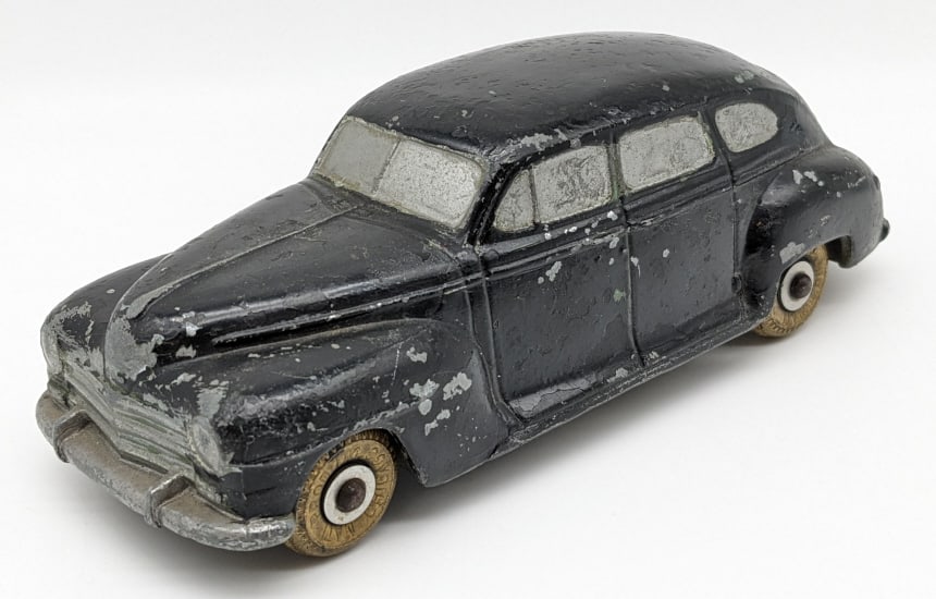 National Products 1940s Plymouth Promo Car: National Products 1940s Plymouth Promo Car. The car has paint loss and wear from play / age. Measures approximately 6-1/4" long