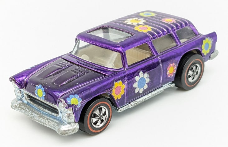 Hot Wheels Redline Purple Classic Nomad: Hot Wheels Redline Purple Classic Nomad. Appears to be in excellent to near mint condition with light wear from age adn dispaly. It is loaded with daisies as seen, has excellent wheels, and base is cl