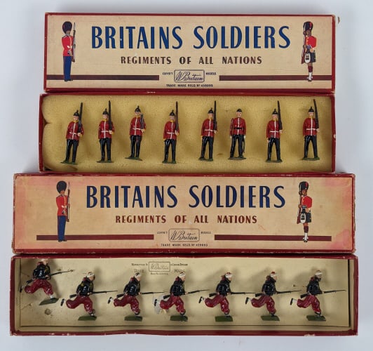 Britians Fort Henry Guards & Zouaves (Charging): Britians Toy Soldiers No. 2148 Fort Henry Guards and No. 142 Zouaves (Charging). The figures have paint chipping and edge wear. The label on the No. 2148 box has been replaced.
