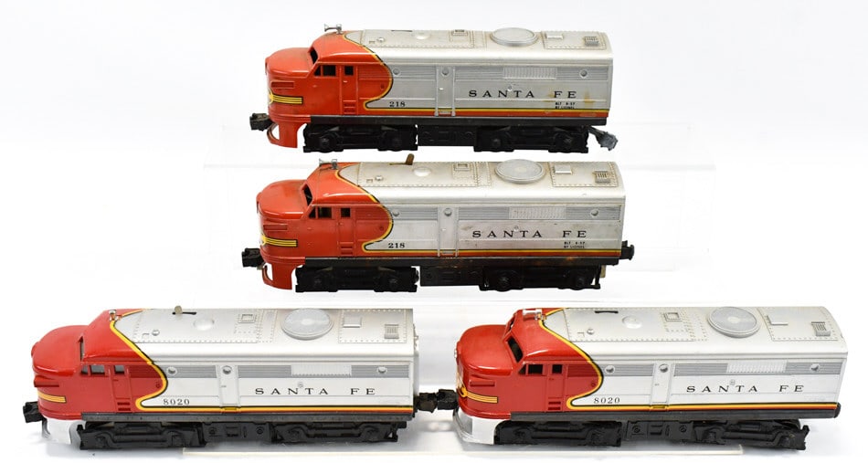 Lionel Santa Fe #8020 AA & #218 AA Locomotives: Lionel Santa Fe #8020 powered and nonpowered unit and Santa Fe #218 powered and nonpowered unit. All of the locomotive have corrosion and wear from use / age.