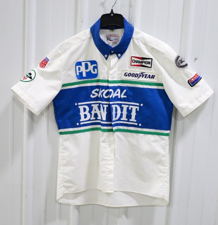 Skoal Bandit All American Racers Team-Issued Shirt: 1985 Skoal Bandit All American Racers Team-Issued Indycar Crew Shirt. The shirt is in nice used condition and has sponsor patches on the front, back, and sleeves.