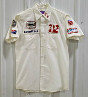 Dubonnet Curb Records All American Racers Shirt: 1984 Dubonnet Curb Records All American Racers Team-Issued Indycar Crew Shirt. The shirt is in nice used condition and has sponsor patches on the front, back, and sleeves, embroidered "Tim" on the