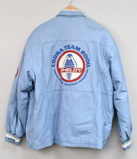 Carroll Shelby Childrens Foundation Leather Jacket: Shelby Cobra Team 2000 leather jacket owned by Bill Neale. Bill was a part of most of Carroll's benevolence projects. The Carroll Shelby Children's Foundation was important to both men. Bill was