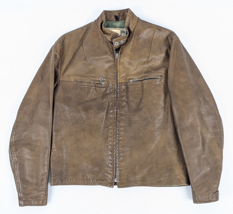 1970's Harley-Davidson Brown Leather Jacket: 1970's Harley-Davidson Brown Leather Jacket. Jacket features two chain pull chest pockets, green satin liner, original Harley tag, and is marked size 40. Jacket is in nice condition with some light ge
