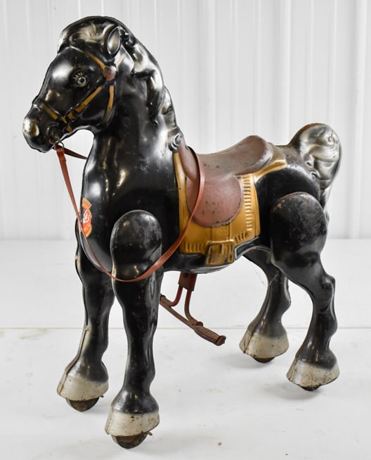 MOBO Black Bronco Ride On Horse: MOBO black Bronco ride on horse. The horse is in original condition with discoloration, paint loss, and wear from age. Measures approximately 25" long by 32" tall.