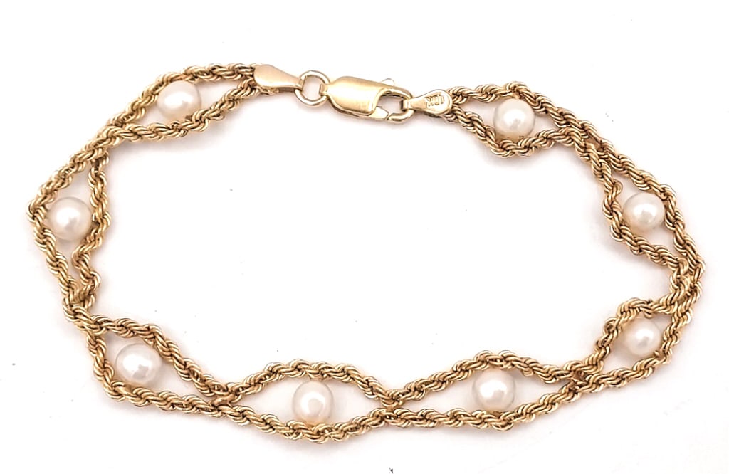 Ladies 10K Yellow Gold Pearl Rope Bracelet: Ladies 10k yellow gold 7-5/8" pearl rope bracelet. Total weight approximately 5.06 grams.