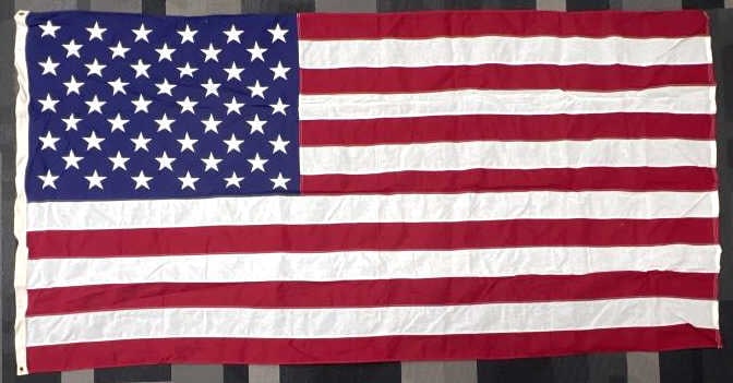 50 Star American Flag 58 x 111 Made in USA: 50 Star American Flag 58 x 111 Made in USA. The 50 star flag is in very nice used condition. Flag measures 58 x 111 inches.