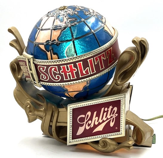 Vintage Schlitz Beer Globe Lighted Sign: Vintage Schlitz Beer Globe Lighted Sign. The Schlitz Globe is in nice used condition. The globe lights up when plugged in. Sign does obtain a broken piece on the belt buckle. Sign was made in 1976. A 