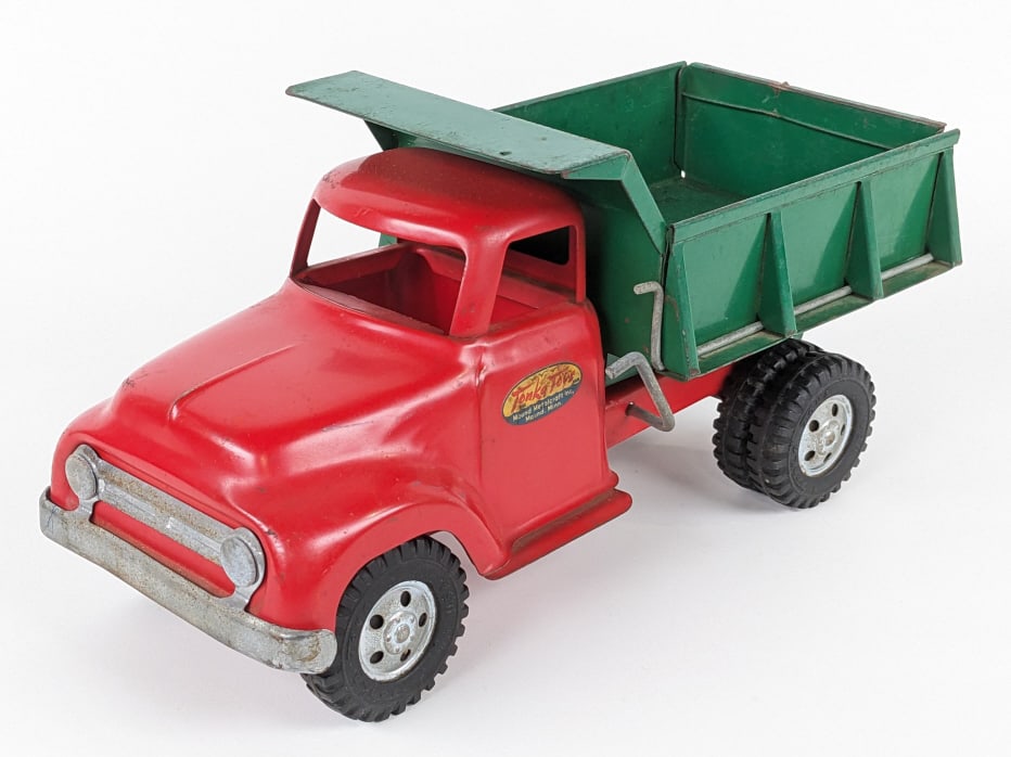 Original Tonka Round Fender Dump Truck: Original Tonka round fender dump truck. The truck has paint loss, scratches, and wear from play / age. Measures approximately 13" long.