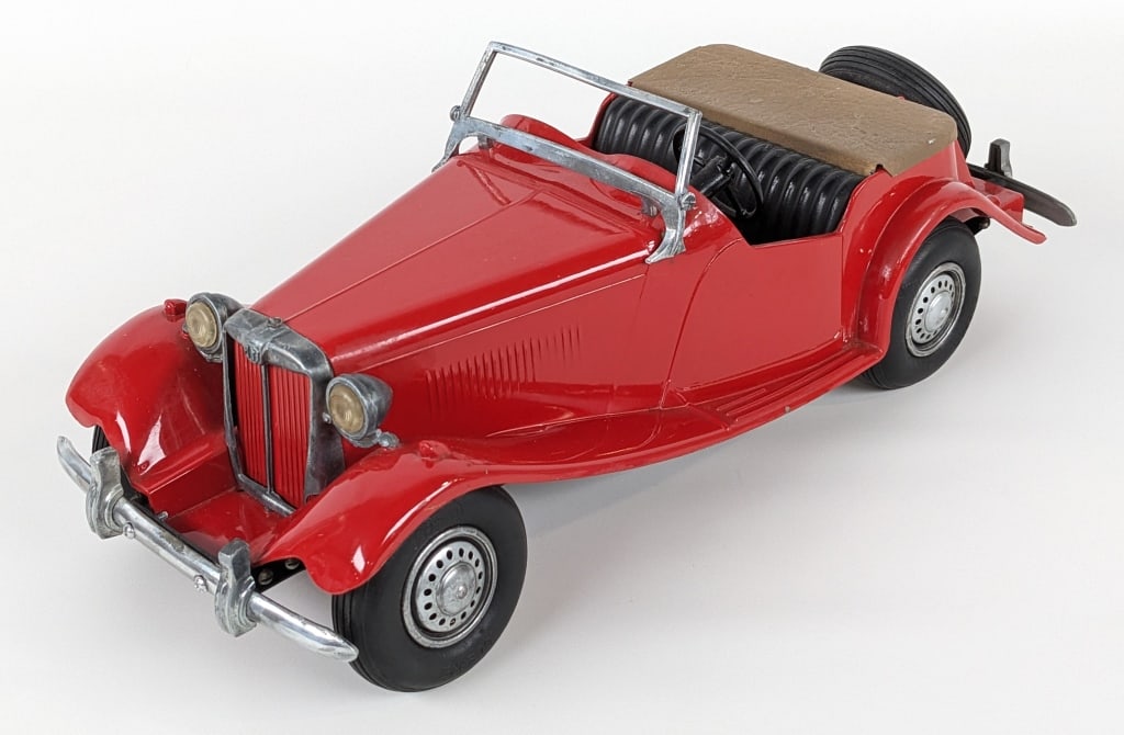 Restored Doepke Model Toys MG Roadster Convertible: Restored Doepke Model Toys MG Roadster convertible car. The car has a nice restoration with new parts. Good condition with light wear from storage / display. Measures approximately 15" long.