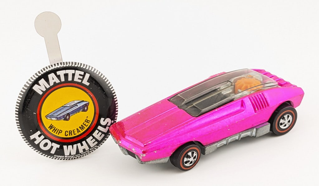 Hot Wheels Redline Pink Whip Creamer - U.S.: Hot Wheels Redline pink U.S. Whip Creamer with black interior. The car has a couple minor chips and a shiny base. It comes with a metal Whip Creamer button.