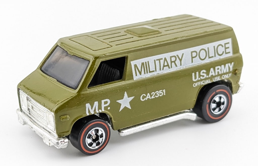 Hot Wheels Redline Khaki Kooler Military Van: Hot Wheels Redline Flying Colors Khaki Kooler U.S. Army Military Police van. The van has a couple micro chips on the top and minor surface scratching to the metal base. Overall a very nice clean examp