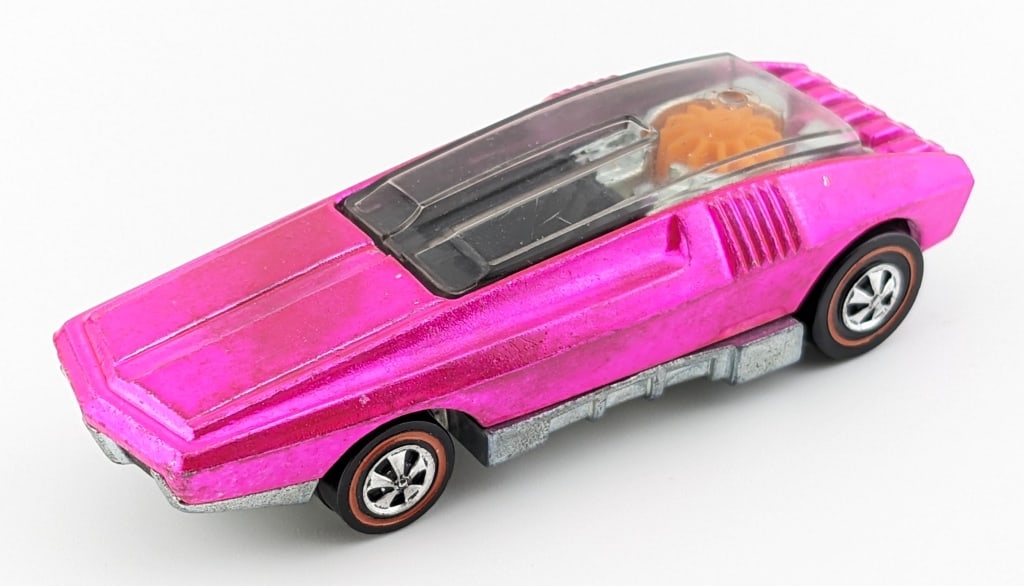 Hot Wheels Redline Hot Pink Whip Creamer - U.S.: Hot Wheels Redline U.S. hot pink Whip Creamer. The car has some toning to the hood. Overall displays very well with excellent wheels and clean base.