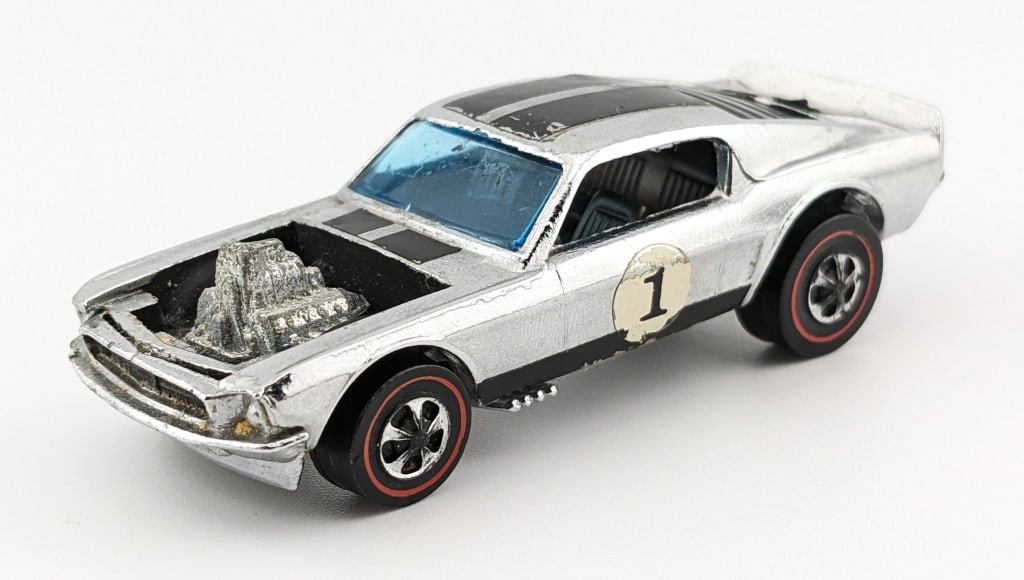 Hot Wheels Redline Chrome Boss Hoss Club Kit Car: Hot Wheels Redline chrome Mustang Boss Hoss club kit car. The stripes on the roof aren't straight, it has decal loss, rubs, chrome loss to the wheels, and shiny base.