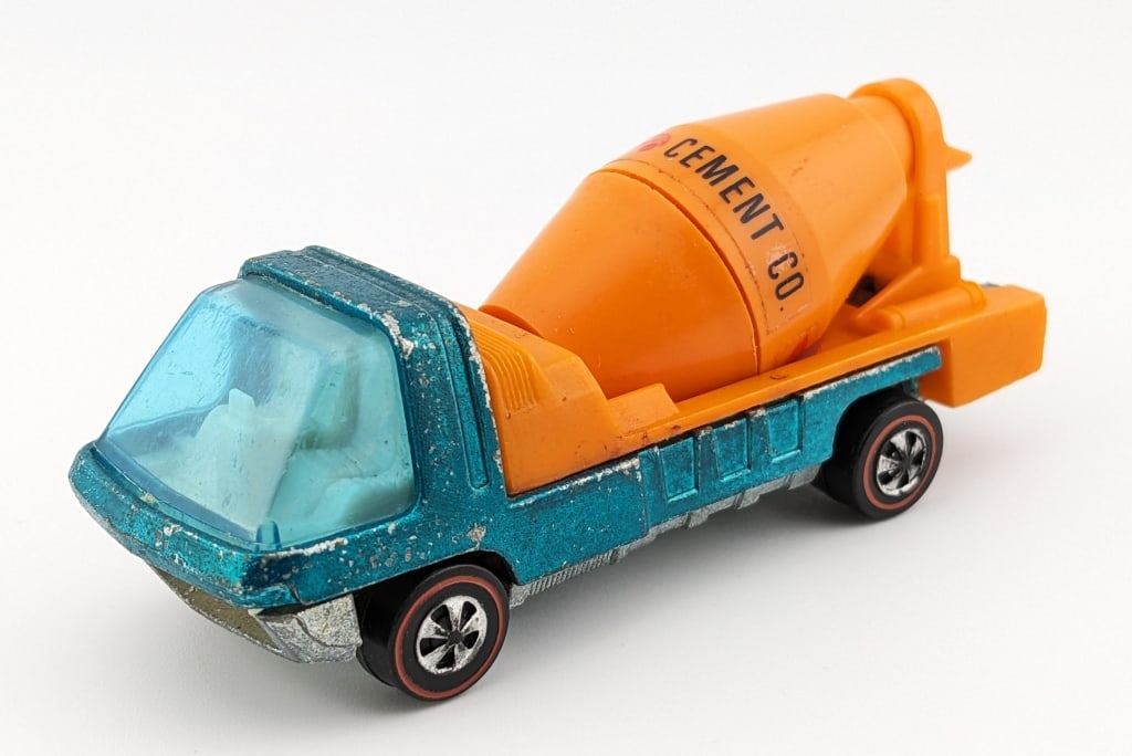 Hot Wheels Redline Aqua Cement Mixer: Hot Wheels Redline The Heavyweights aqua Cement Mixer truck. The truck has scattered paint chips, oxidation to the base, and wear from age.