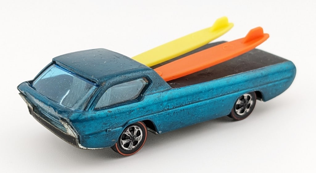 Hot Wheels Redline Aqua Deora w/ Dark Interior -HK: Hot Wheels Redline aqua Deora with dark interior. The car has some small micro chips and toned base. The surfboards are reproductions.