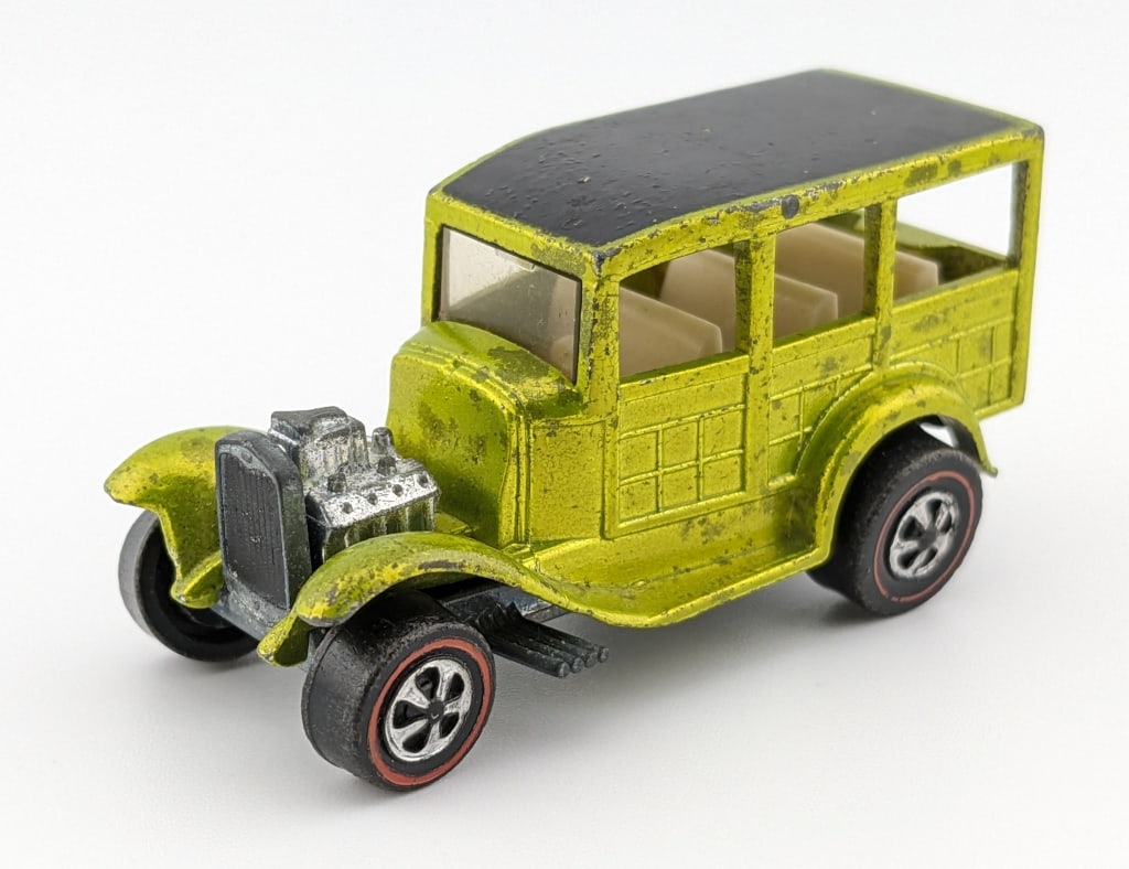 Hot Wheels Redline Antifreeze Classic Ford Woody: Hot Wheels Redline antifreeze Classic '31 Ford Woody with white interior. The car has some toning, roughness to the paint on the roof, and dullness to the base.