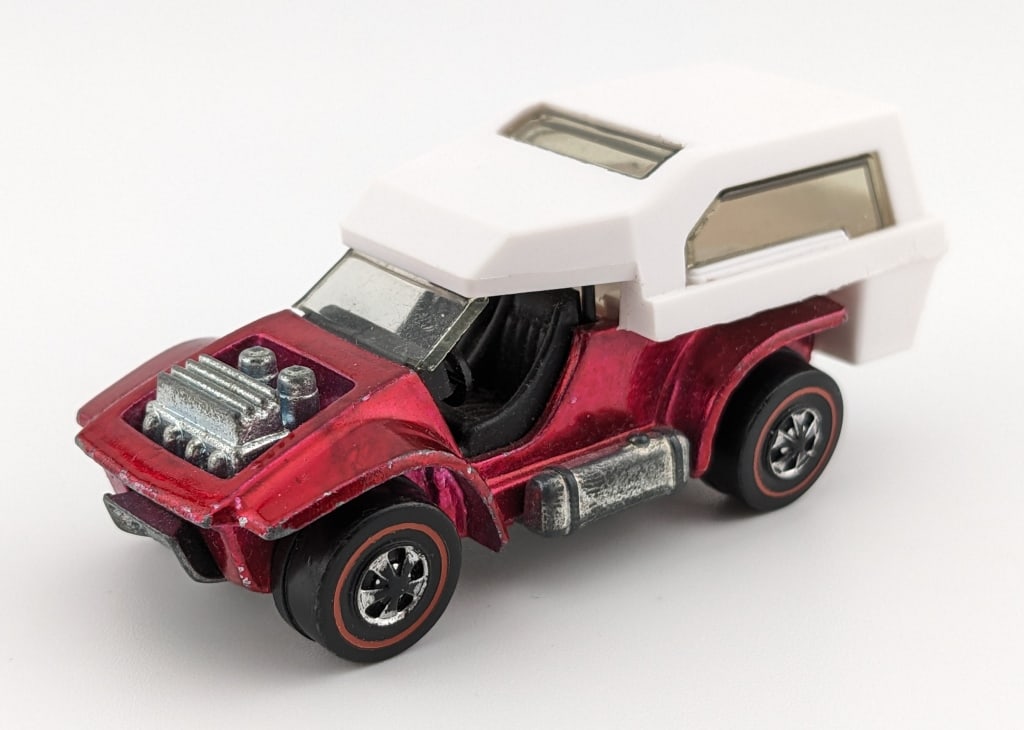 Hot Wheels Redline Red Power Pad: Hot Wheels Redline red Power Pad. The car has some wear around the edges and some spotting on the base.