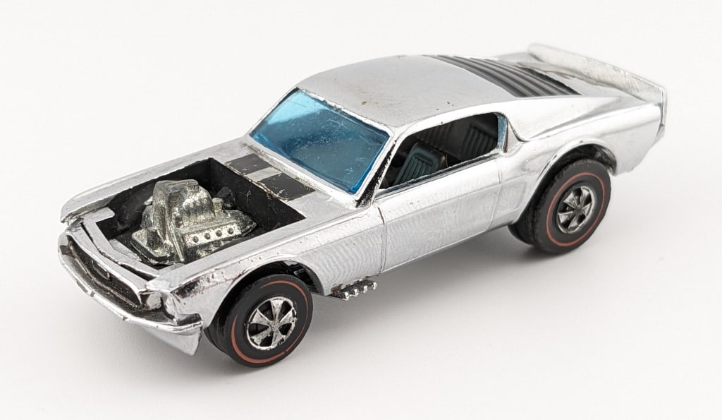 Hot Wheels Redline Chrome Boss Hoss Club Kit Car: Hot Wheels Redline chrome Mustang Boss Hoss club kit car. The car has some decal loss, rubs, chrome loss to the wheels, and shiny base. The car is missing the door decals.