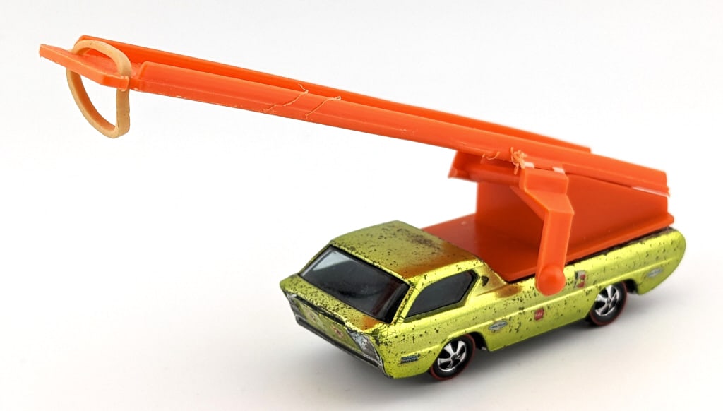 Custom Hot Wheels Redline Sky Show Deora: Custom Hot Wheels Redline Skyshow Deora. The truck is a U.S. Lime Yellow Deora that someone added a new aero launcher on it. The truck has sponsor decals, paint loss, and wear from age. The aero launc