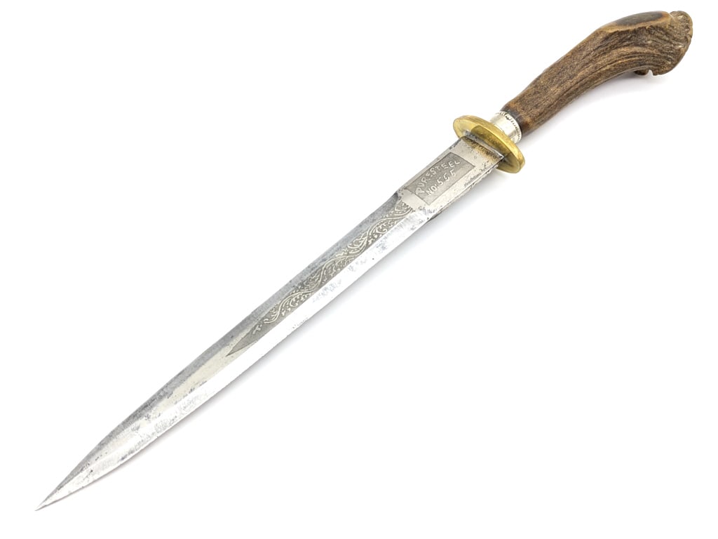 Crown Stag Handle Double Edged Dagger: Crown Stag Handle Double Edged Dagger. Features a double Edged blade etched with scroll work and S.H.S.R A.S.R Puresteel No: 555, brass oblong double guard, and a crown stag handle with a metal collar