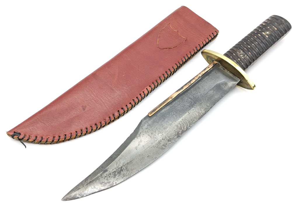 Ornate Horn Handle Confederate Style Bowie Knife: Ornate Horn Handle Confederate Style Bowie Knife. Knife features a large clip point blade with a darkened metal finish, brass spine guard, brass oblong double guard, and fulllered horn handle with a h