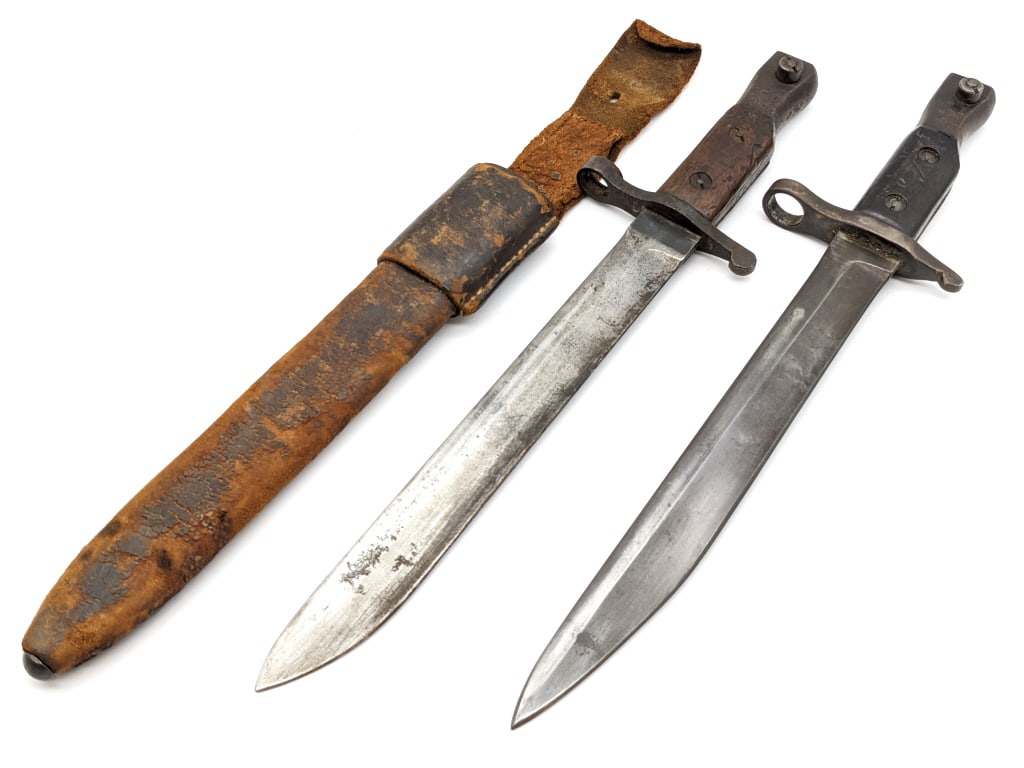 (2) Canadian Ross Rifle Mk II Bayonets: (2) Canadian Ross Rifle Mk II Bayonets. Bayonets are in aged condition with various dings, scratches, and surface rust from age and use. Blade length of 10in and overall length of 14-3/4in.