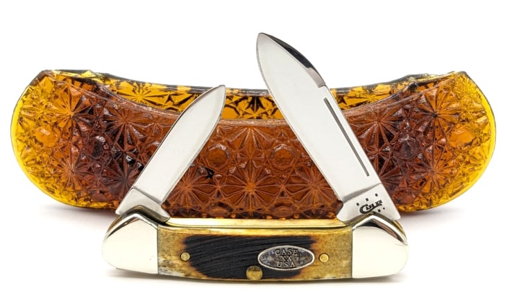 2013 Case XX Sawcut Bone Baby Butterbean w/ Canoe: 2013 Case XX Sawcut Bone Baby Butterbean w/ Canoe Display. Knife is in like new condition and comes with a glass canoe for display. Overall measures 2-3/4in when closed.
