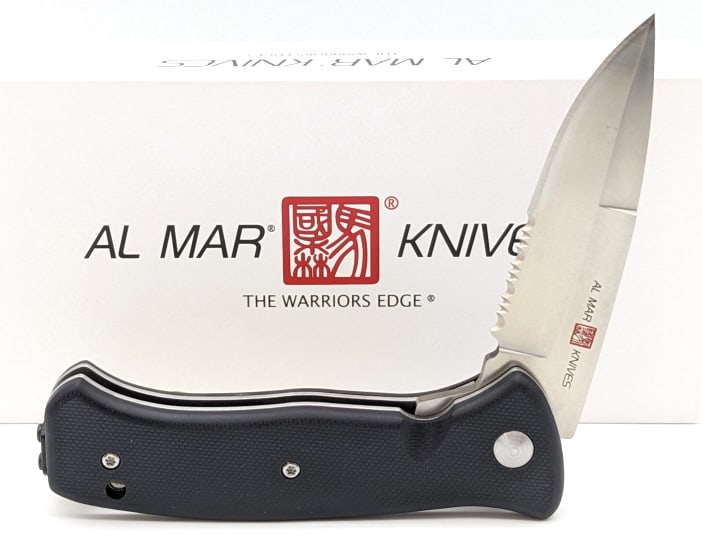 NIB Al Mar SERE 2020 Assisted Open Folding Knife: NIB Al Mar SERE 2020 Assisted Open Folding Knife AMK2201 G Series. Features a spear point blade, and black G-10 handle scales. Overall length of 4-1/8in when closed.