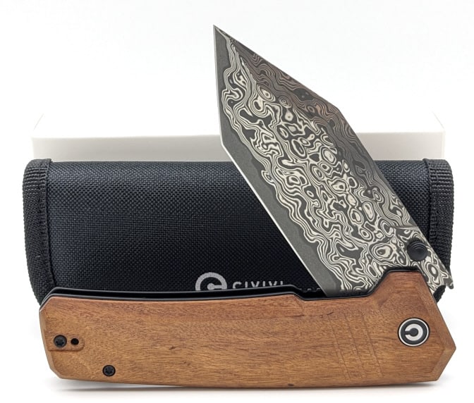 NIB Civivi Bhaltair Guibourtia Damascus Flipper: NIB Civivi Bhaltair Guibourtia Damascus Flipper Knife. Comes with a carrying case and polishing cloth. Features a modified tanto blade, and wood handle scales. Overall length of 5-1/8in when closed.