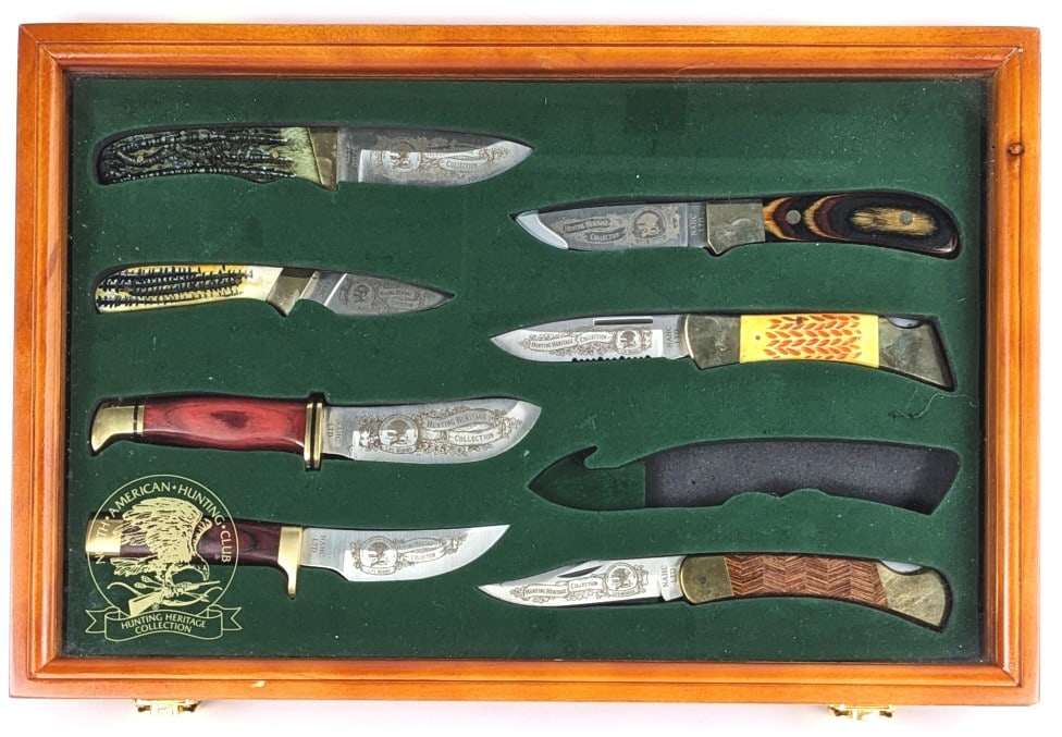 North American Hunting Club Knife Set w/ Case: North American Hunting Club Knife Set w/ Case. Pieces feature various handle materials and designs. Set is missing the gut hook knife. Knives are in very nice condition with light tarnishing from disp