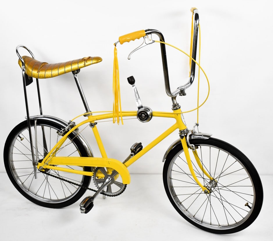 Repainted 1971 Schwinn 3-Speed Sting-Ray Bicycle: Repainted 1971 Schwinn 3-Speed Sting-Ray Bicycle. The bike has a banana seat, Schwinn 3 Speed Stik, handlebar grip tassels, and Schwinn tires. The seat has a few tears, older repaint, paint chips, and