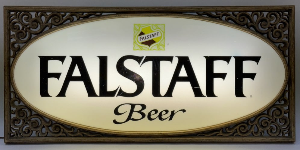 Vintage FALSTAFF Beer Lighted Advertisement Sign: Vintage FALSTAFF Beer Lighted Advertisement Sign. This unique Falstaff Beer light up sign is in good working condition. Framed in plastic wood looking filigree design, with lighting encased in metal.