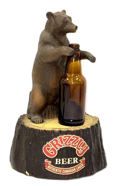 1985 Canadian Grizzly Bear Counter Advert. Display: 1985 Canadian Grizzly Bear Counter Advertisement Display. This piece is set up to hold a bottle as displayed in pictures. It displays nicely with some kracking and chipping due to age and use. 1985 Ex