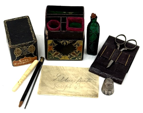 Vintage "Lady's Companion" Tooled Leather Sewing: Vintage "Lady's Companion" Tooled Leather Sewing Kit. This Antique, Gilt Tooled Leather Case Contains A Multitude Of Sewing Tools. The Tools Include A Number 10 Thimble, Bone Needle Holder, Steel Hemm