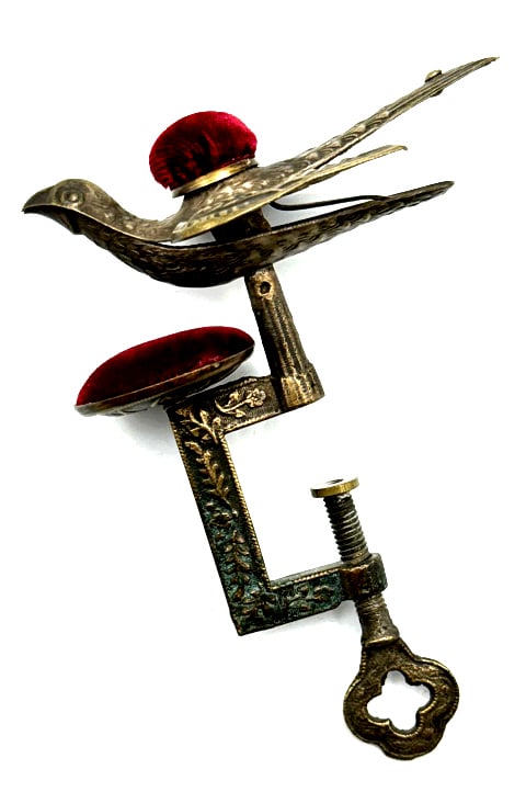 Antique Embossed Victorian Bird Double Pin Cushion: Antique Embossed Victorian Bird Double Pin Cushion. This Highly Detailed Brass and Velvet Sewing Tool Has A Church Key Style Table Clamp and A Bird Mouth Spring Clamp. Both Clamps Are In Good Working 