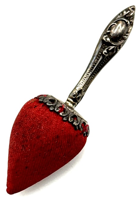 Antique Victorian Sterling Strawberry Pin Cushion: Antique Victorian Sterling Strawberry Pin Cushion. This 1900's Pin Cushion Has Ornate Detailing On The Handle As Well As The Attachement Edges For The Cushion. There Are Oval Areas Acceptable To Engra
