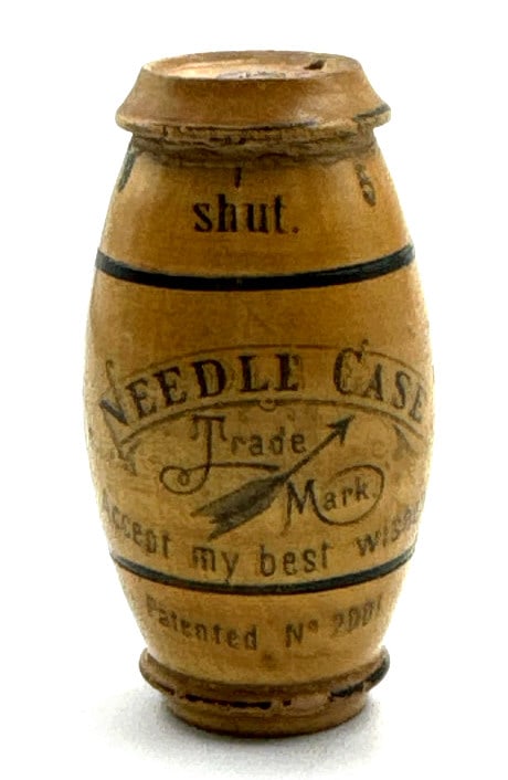 Antique Wood Needle Case Made In Germany: Antique Wood Needle Case Made In Germany. This Barrel Shaped Needle Case Has "Needle Case, Trade Mark, Accept My Best Wishes, Patented No 2001 Art B, Germany" and Instructions Printed Around The Outsi