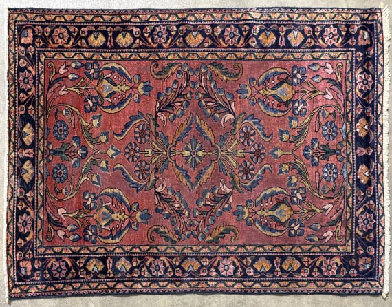 Antique Persian 57" x 42-1/2" Area Rug: Antique Persian wool area rug. Measures approximately 57" x 42-1/2" and is in good condition with some use wear.