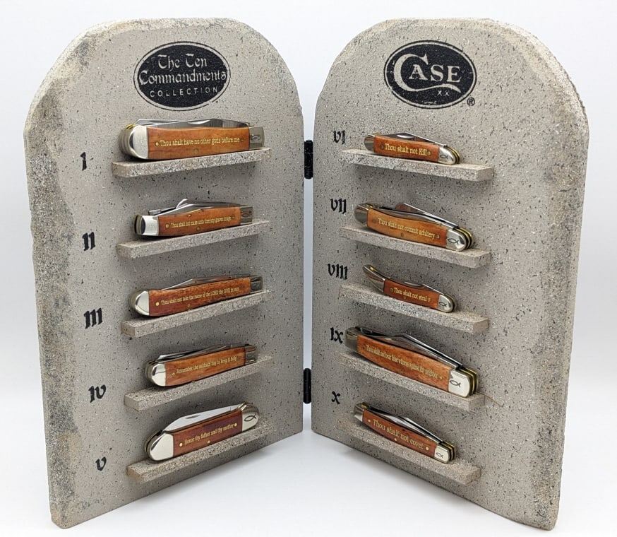 2015 Case XX Ten Commandments Knife Set 1 of 250: 2015 Case XX Ten Commandments Knife Set 1 of 250.? This set of 10 Case XX knives comes with a wooden display that is finished to give the stone appearance. Two small magnets in each shelf hold the kni