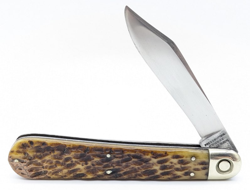 Early Walden Press Button Knife Co Switchblade: Early Walden Press Button Knife Co Switchblade. Knife is in nice used condition with a polished blade with material loss from use, nice polished bolsters, and bone handle scales with one pin crack and