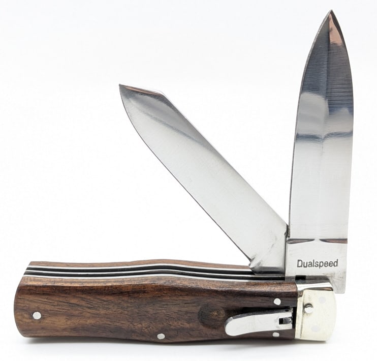 Dual Speed Two Blade Leverlock Switchblade Knife: Dual Speed Two Blade Leverlock Switchblade Knife. Knife features a single edge blades, and wood handle scales. Knife is in very nice condition with minimal wear. Overall measures 4-3/4in when closed.
